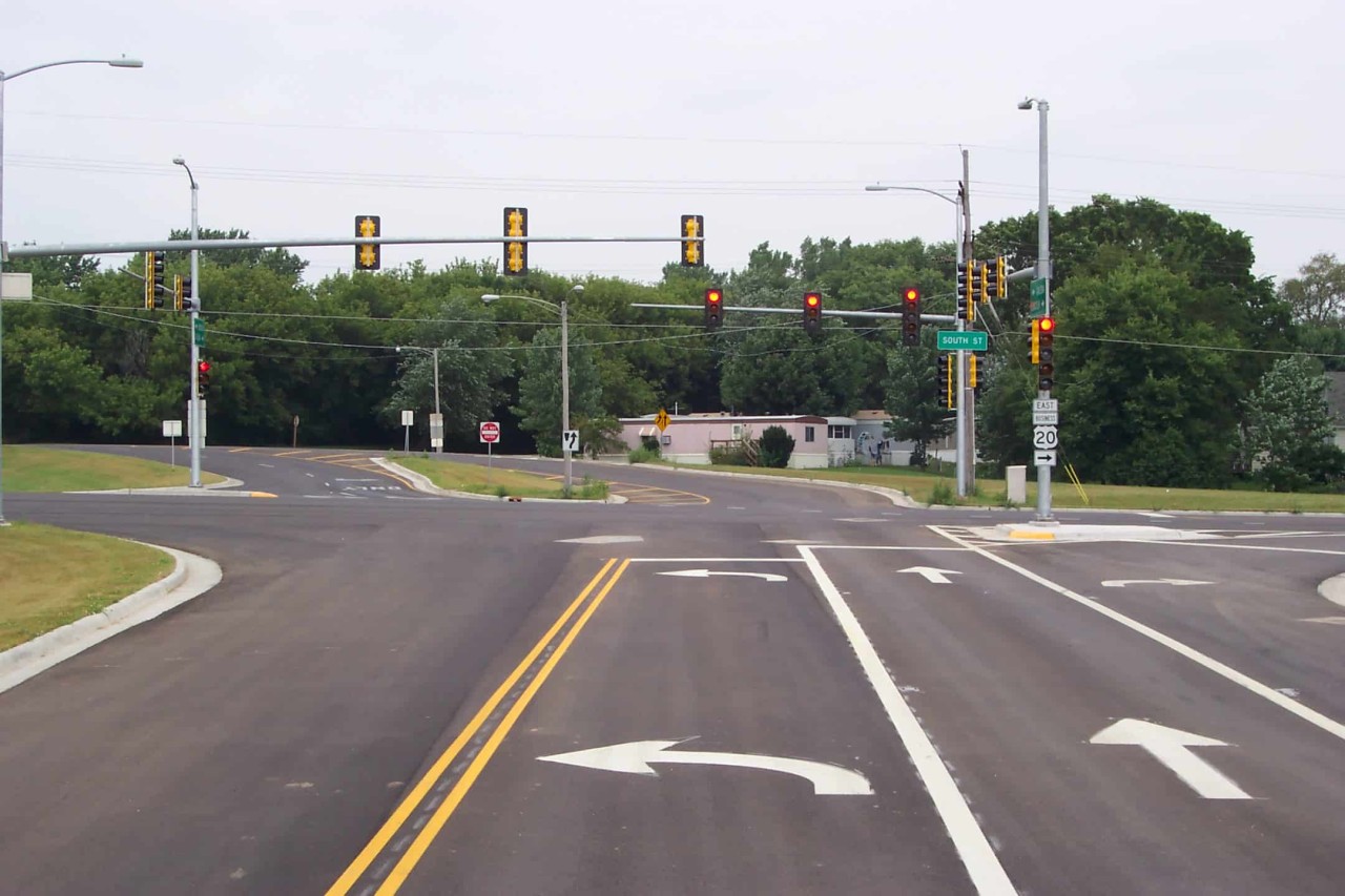 An empty intersection with traffic lights